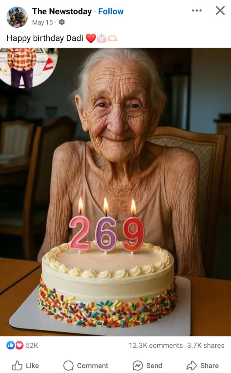 A smiling elderly woman sitting behind a birthday cake with number candles 2, 6, and 9, celebrating her supposed 269th birthday.